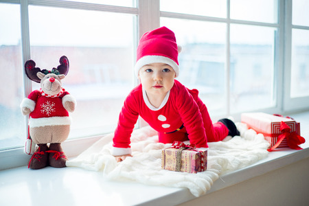 Baby in a christmas hatの写真素材