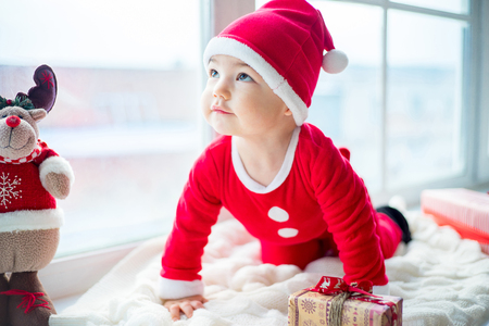 Baby in a christmas hatの写真素材