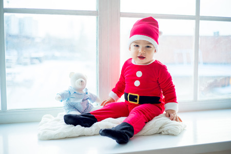 Baby in a christmas hatの写真素材
