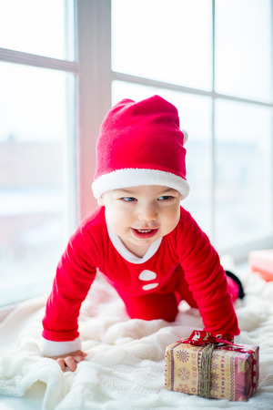Baby in a christmas hatの写真素材