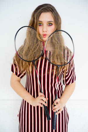 Girl with a badminton racketの写真素材