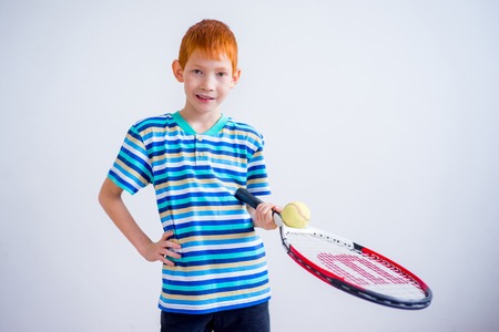 Boy playing tennisの写真素材