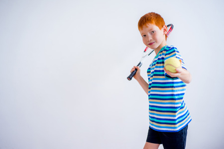 Boy playing tennisの写真素材