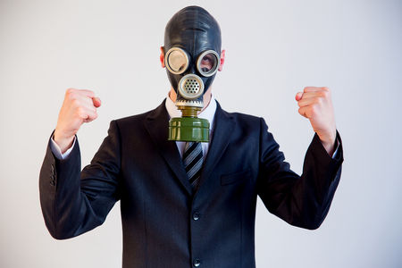 Businessman in a gas maskの写真素材