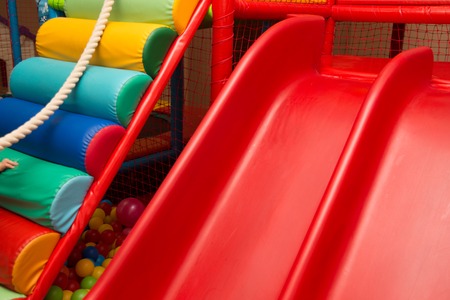 Kids playing in a pool of ballsの写真素材