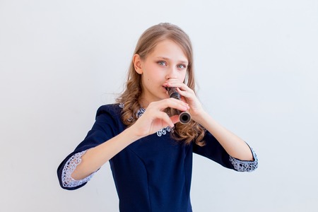 Girl playing on a fluteの写真素材