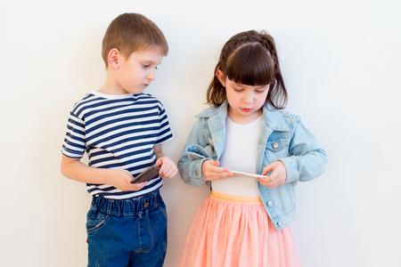 kids using different gadgetsの写真素材