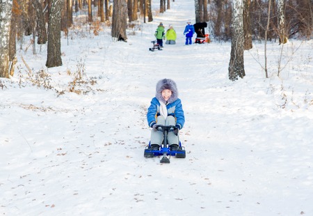 kids playing outside in winterの写真素材