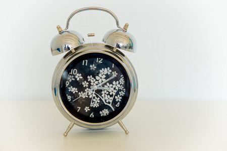Retro alarm clock on a wite table