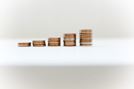 Image of coin stacks on a white background