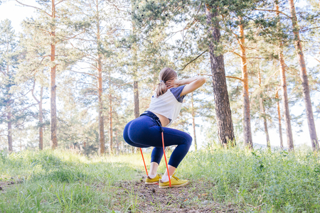 woman doing exercises in a parkの写真素材