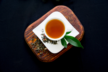 Cup of tea and mint on a dark backgroundの写真素材