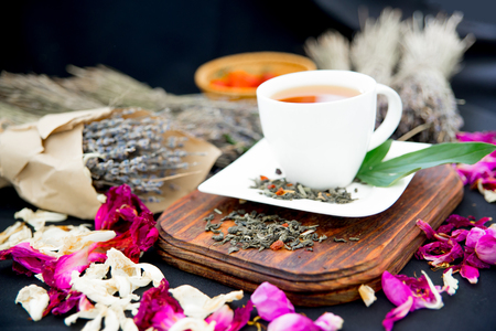 Cup of tea and mint on a dark backgroundの写真素材