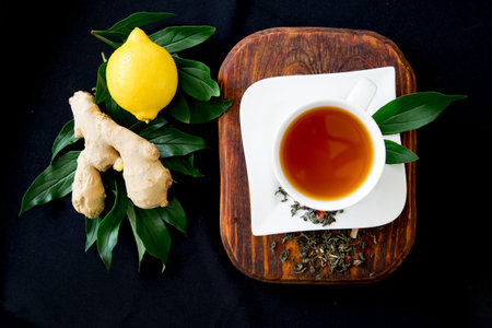 Cup of tea and mint on a dark background