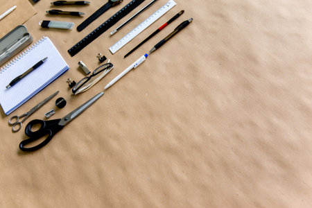 stationery pen scissors notebook on a wooden table