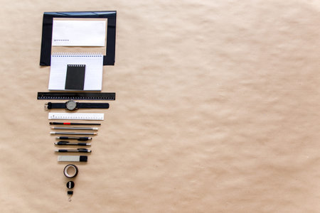 stationery pen scissors notebook on a wooden table