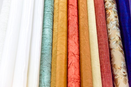 Rolls of fabric and textiles in a shop or storeの写真素材