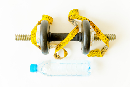 scales and and fruit on a floor, training and healthy lifestyle conceptの写真素材