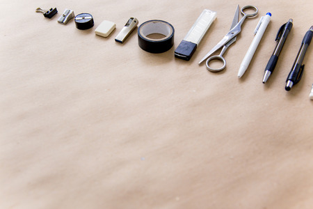 stationery pen scissors notebook on a wooden tableの写真素材