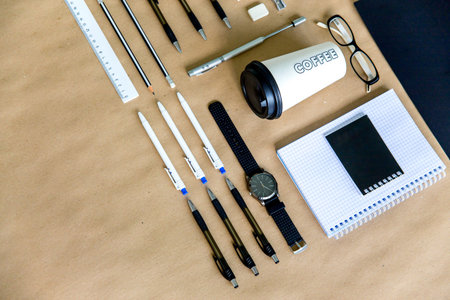stationery pen scissors notebook on a wooden table