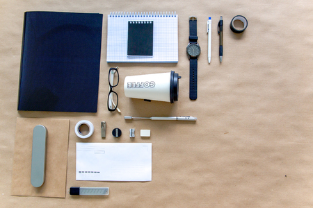 stationery pen scissors notebook on a wooden tableの写真素材