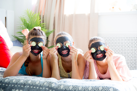 Girls having fun on slumber party togetherの写真素材