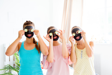 Girls having fun on slumber party togetherの写真素材