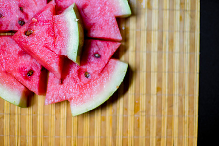 an image of a Fresh sliced red watermelon on a tableの写真素材