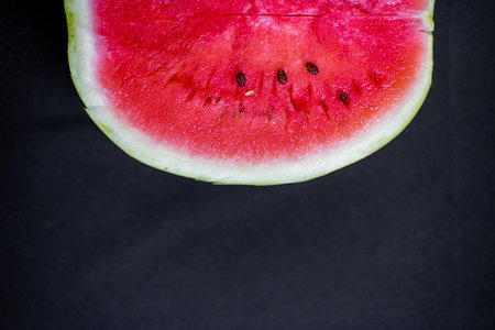 an image of a Fresh sliced red watermelon on a table
