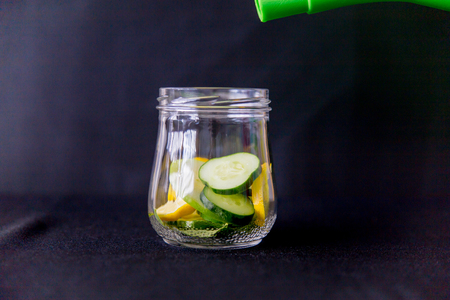 Summer drink coctail strawberry smoothies in glass jar, berries and mint. Healthy food, diet and weight loss conceptの写真素材