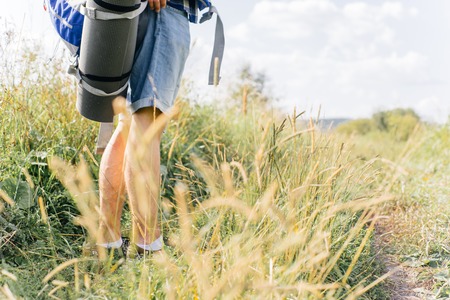 young traveler guy hiking with backpack in the natureの写真素材