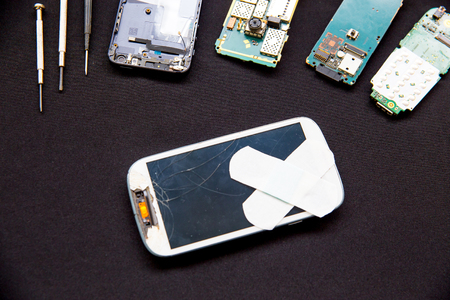 smartphone parts and repairing tools, flat lay, top viewの写真素材