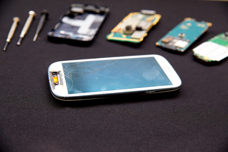 smartphone parts and repairing tools, flat lay, top viewの写真素材