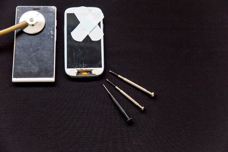 smartphone parts and repairing tools, flat lay, top viewの写真素材