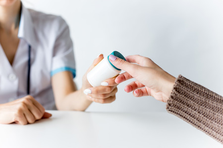 a portrait of a Doctor and a patient during an appointmentの写真素材