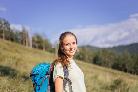tourist hiked on top of a mountain and enjoying the view