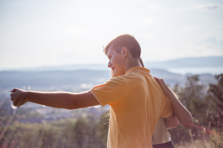 Two hikers taking selfie on top of the mountainの写真素材