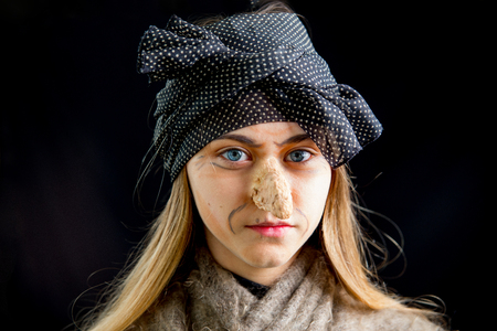 A young woman wearing a witch costumeの写真素材