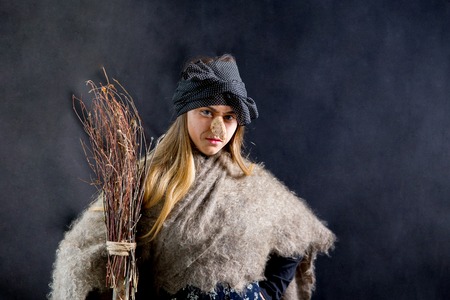 A young woman wearing a witch costumeの写真素材
