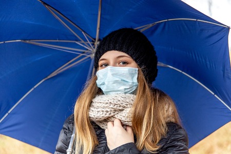 Cold and flu. Woman with a medical face maskの写真素材