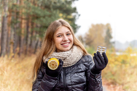 Sick woman with flu is holding a lemonの写真素材