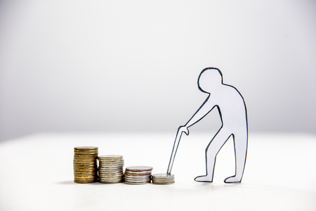 retirement fund concept - money and a calculatorの写真素材