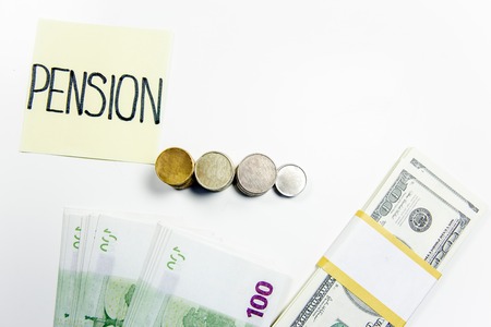 retirement fund concept - money and a calculatorの写真素材