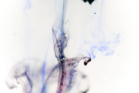 a drop of paint pouring in water
