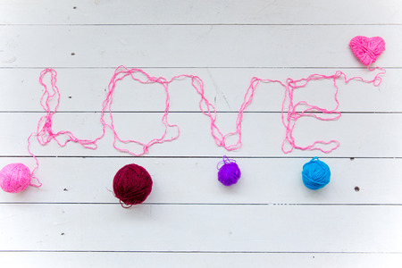 Love word from colorful cotton threads from knitting yarnsの写真素材