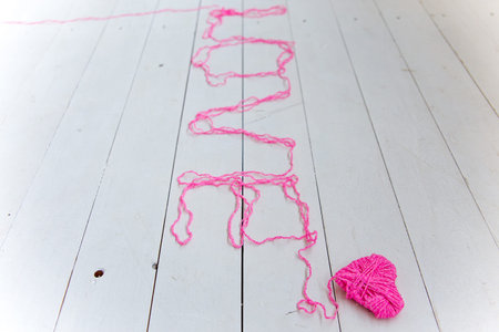Love word from colorful cotton threads from knitting yarns
