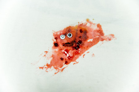 strokes and blots of paint on white backgroundの写真素材