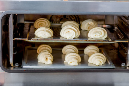 different kinds of pastry are being cookedの写真素材