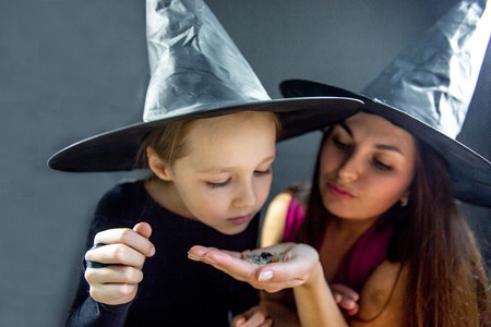 Mother and her daughter wearing halloween costumesの写真素材