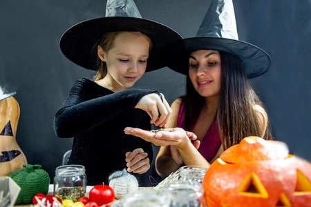 Mother and her daughter wearing halloween costumesの写真素材